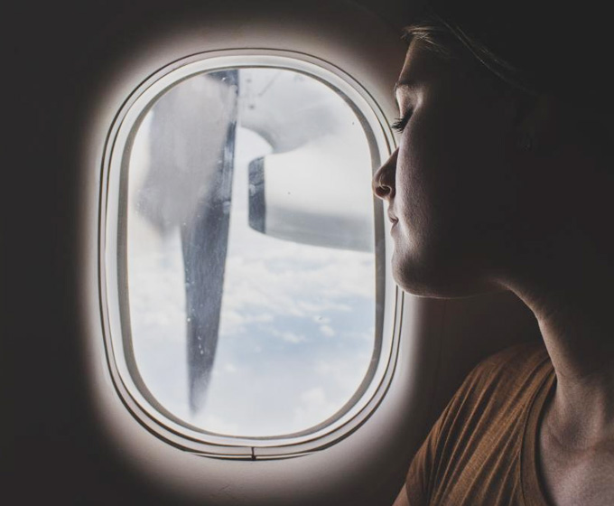 Blogger travelling in a plane